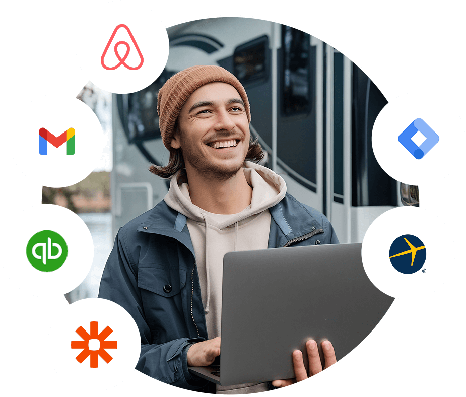 Man using laptop with RoverPass integrations like Airbnb and QuickBooks