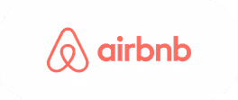 The iconic coral-colored Airbnb logo and wordmark on a white background.