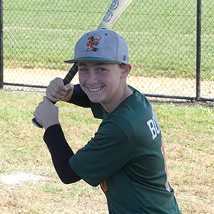 A waist up shot of Elkridge Hurricanes player Lucas Bonney in his batting stance looking at the camera.
