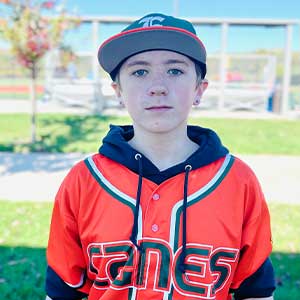 Headshot of Elkridge Hurricanes player Parker Bernadzikowski wearing his orange Canes baseball jersey and green Elkridge E logo hat.