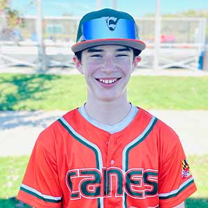 Headshot of Elkridge Hurricanes player Parker DeMarzo wearing his orange Canes baseball jersey and green Elkridge E logo hat.