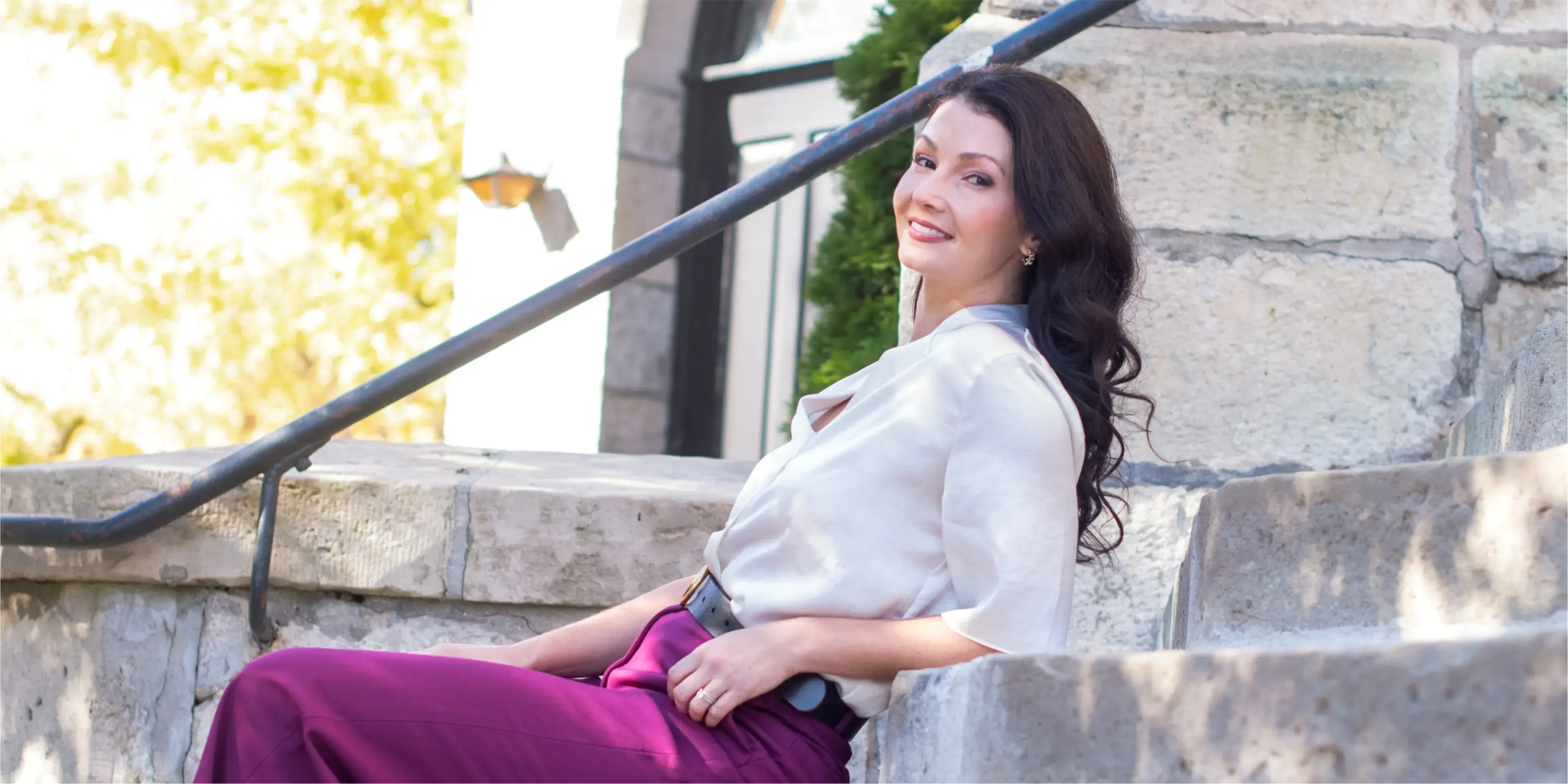 Dr Julia Chrapka in a white shirt and purple pants.