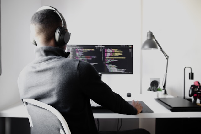 Developer coding on a PC.