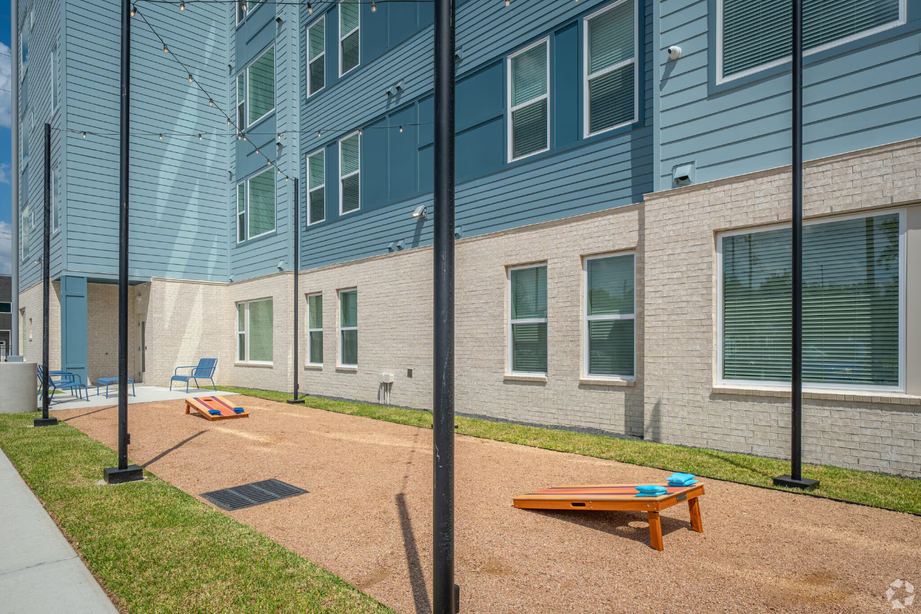 exterior gaming area with corn hole 