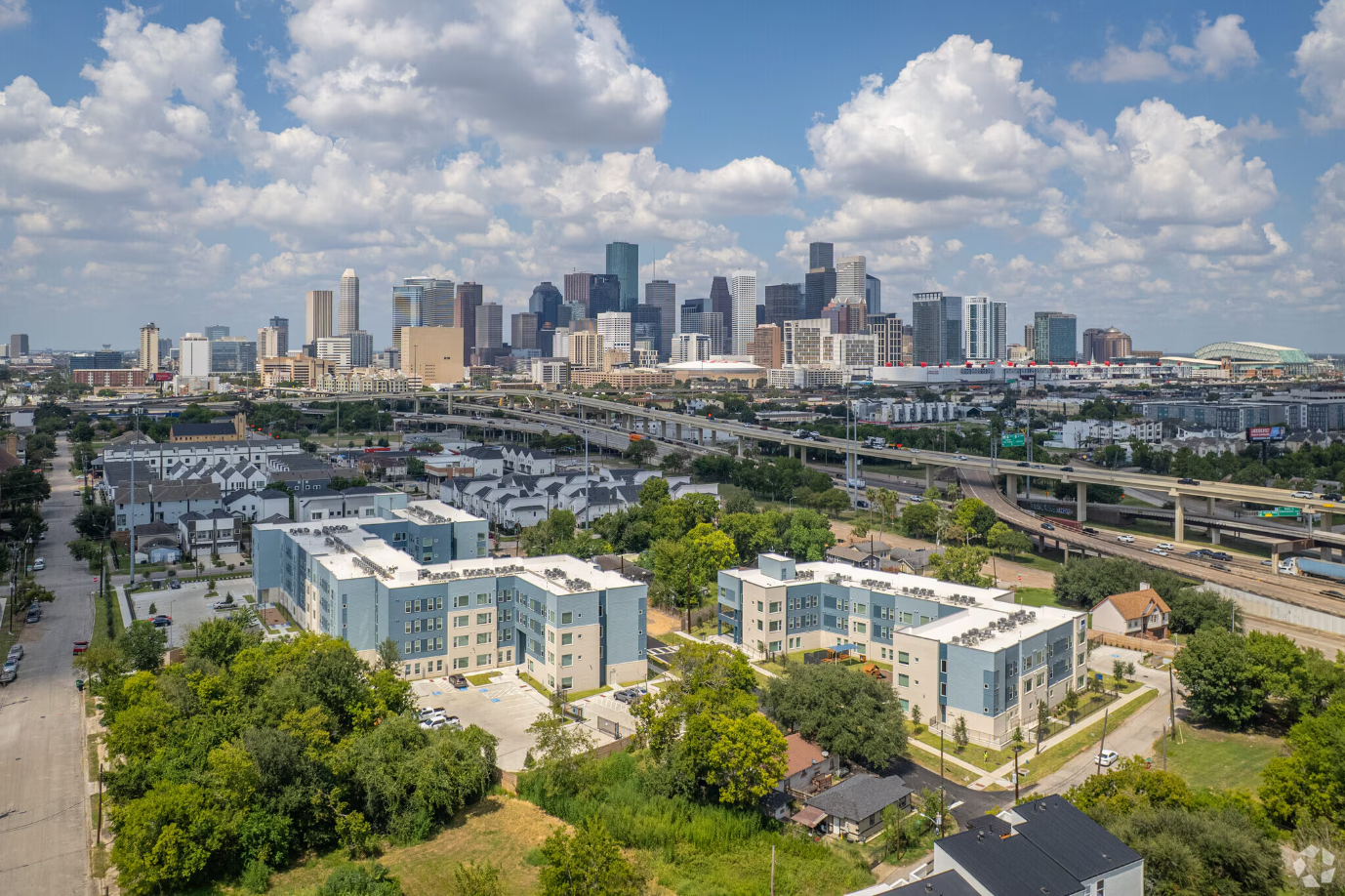 Exterior birds eye view of gray and surrounding neighborhood 