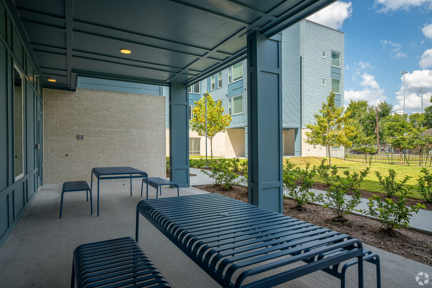 exterior seating area with view of greenery 