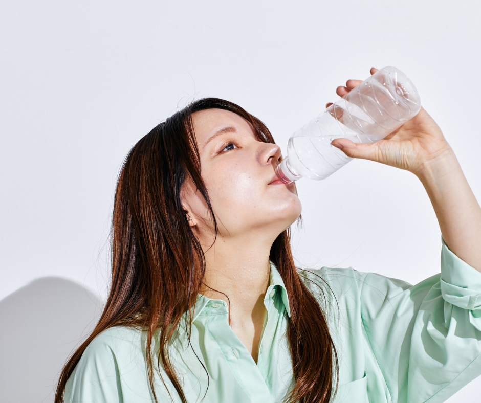 A person experiencing common hangover symptoms like headache and fatigue.