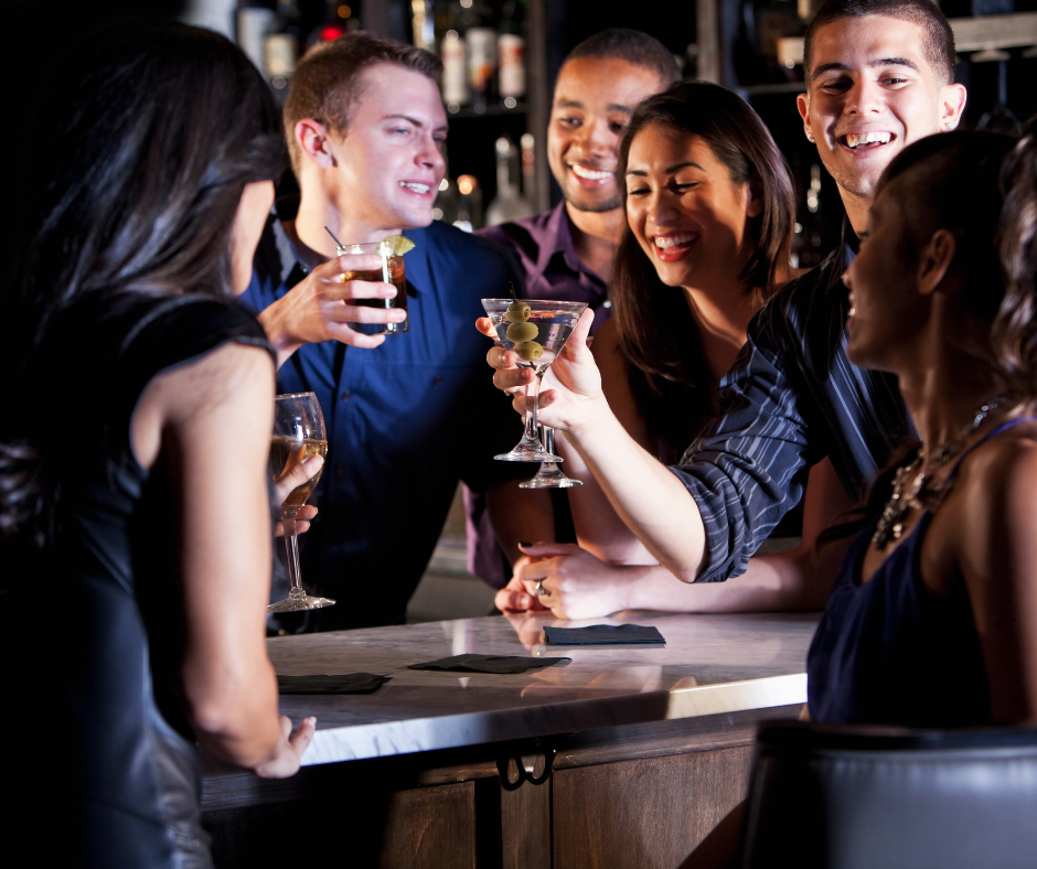 A group of people socializing, highlighting individuals who may be at risk of experiencing hangxiety.