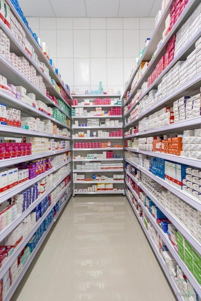 Various cough and cold medicines displayed on a shelf, illustrating the potential for addiction.