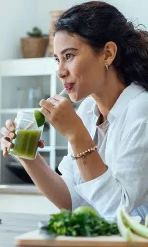 An image depicting a person looking at a drug test kit, contemplating the effectiveness of detox drinks for passing drug tests, particularly for opioids.