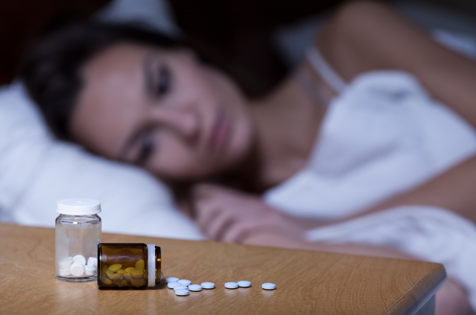 An illustration representing gut health and Suboxone treatment, showing a blurred image of a medication bottle in the background.