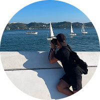 Sam takes a photo of the Tagus River.