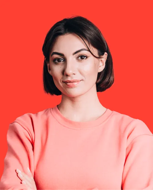 A woman with her arms crossed posing for a picture.
