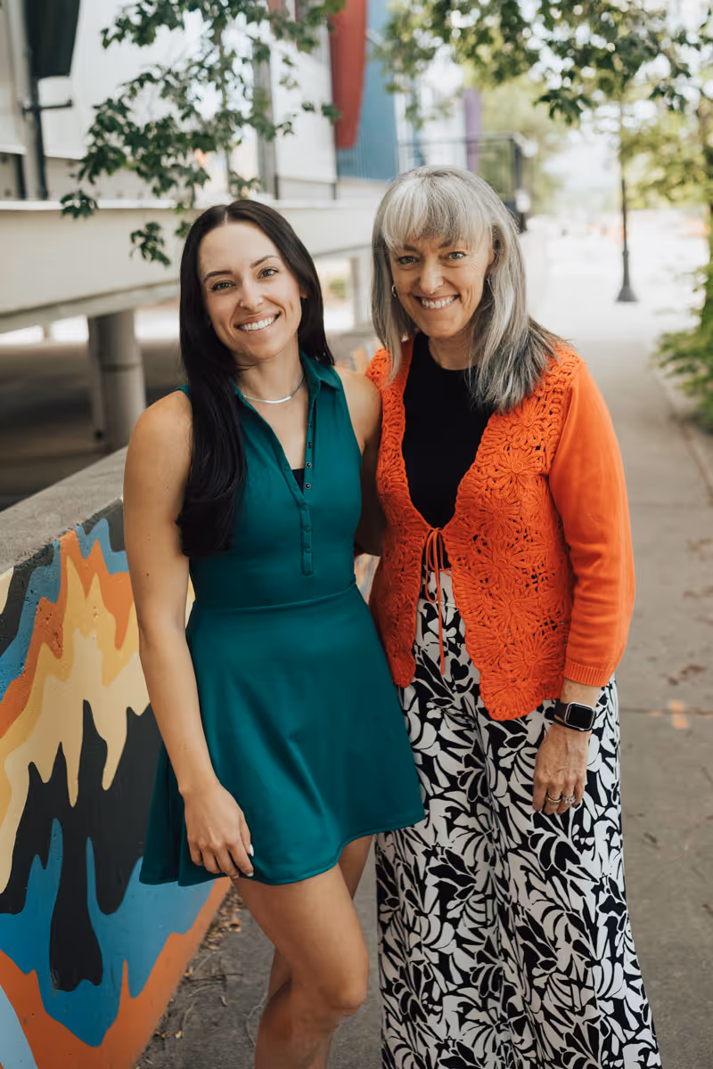 Lea anne and a woman from the next steps team pose for a photo