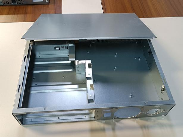 A metal box with a metal lidDescription automatically generated with medium confidence