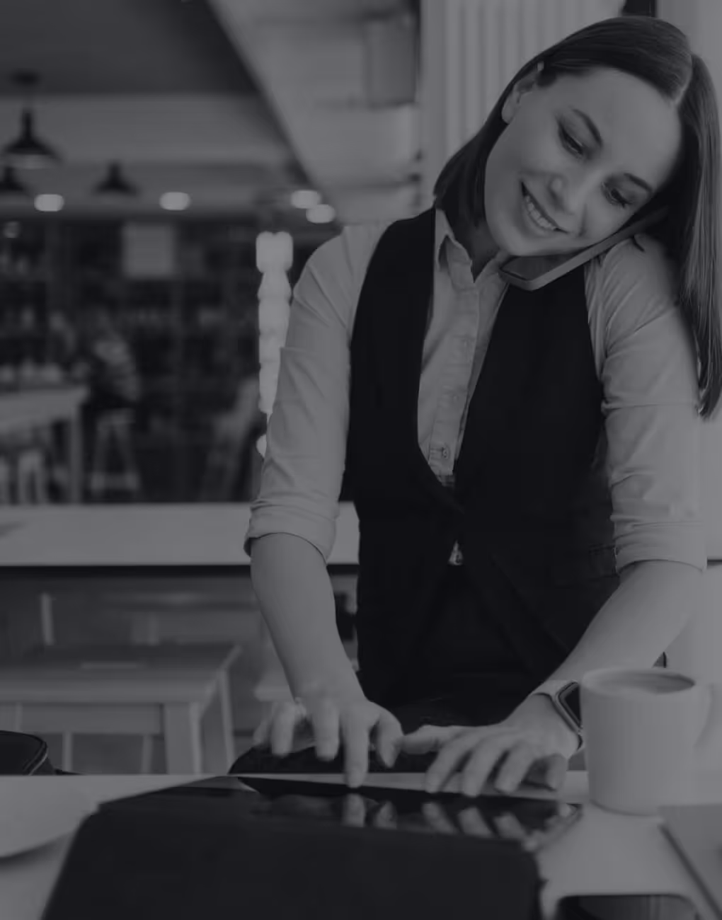 Waitress taking a booking over the phone
