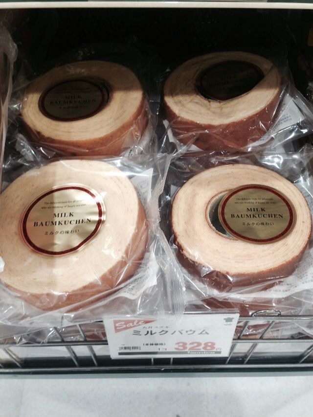 This may contain: four rolls of wood are wrapped in plastic