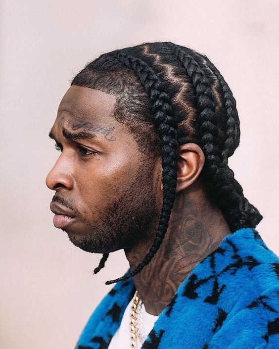  Pop Smoke cornrow braid style with side parts and braids swept to each side