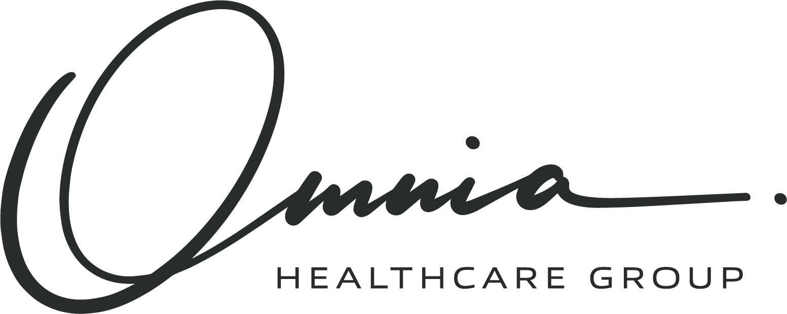 Black rectangular card with the word OMNIA in white capital letters centered.