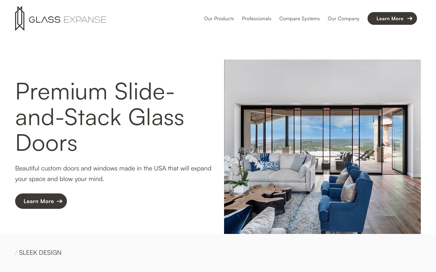 Screenshot of the Glass Expanse website hero section featuring slide-and-stack glass doors