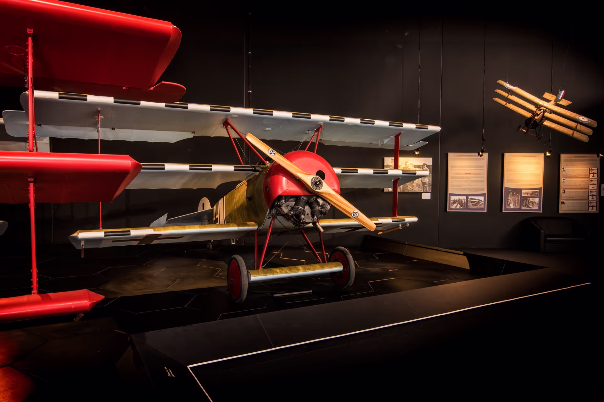 A red and yellow airplane on display at Omaka Aviation Heritage Centre.