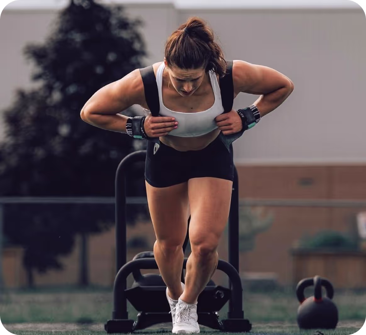Girl working out with heavy weights