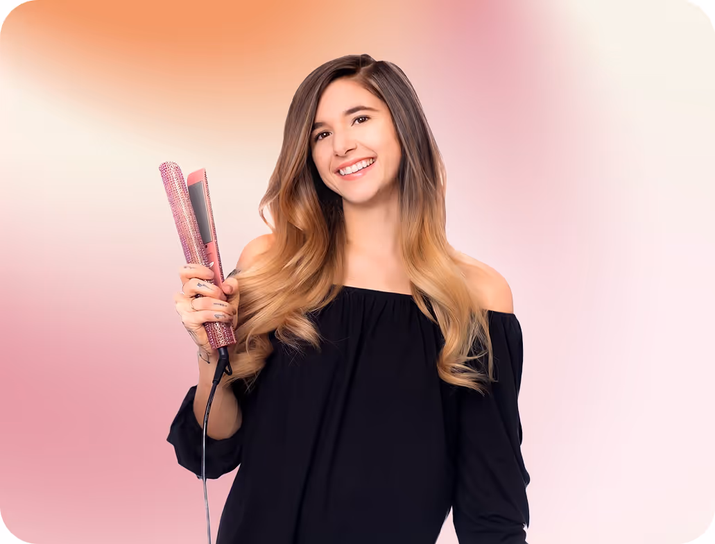 Jo Hearts Hair extension specialist in Lone Tree CO showcasing professional expertise and friendly personality in branded attire