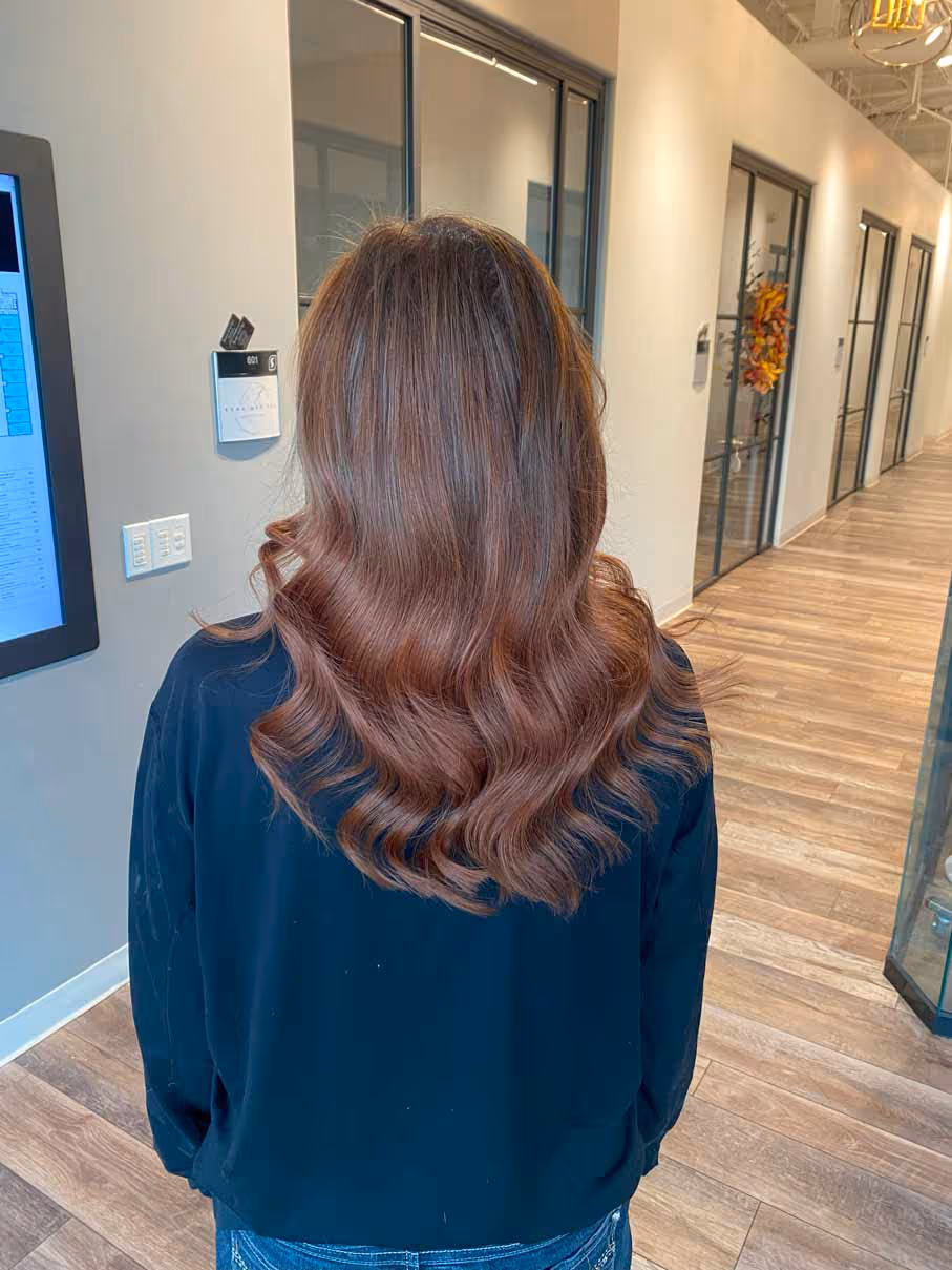 Before and after hair transformation featuring luxurious auburn sew-in extensions at Jo Hearts Hair Denver salon