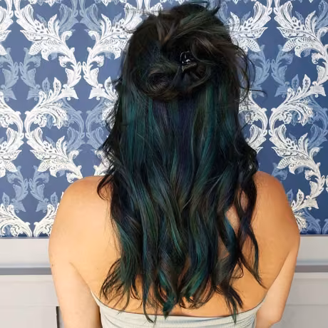 Custom emerald green hair extension application at Jo Hearts Hair, featuring creative color work in Lone Tree salon
