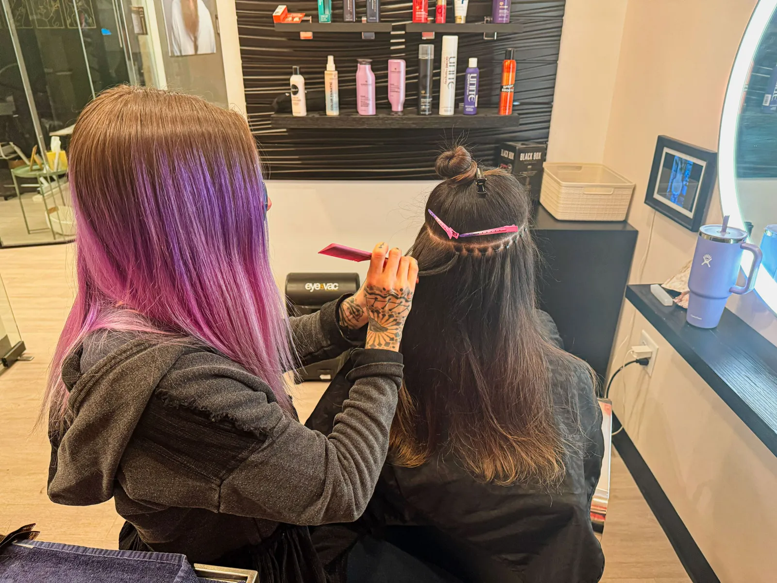 Jo installing hair extensions at her studio in Lone Tree, CO