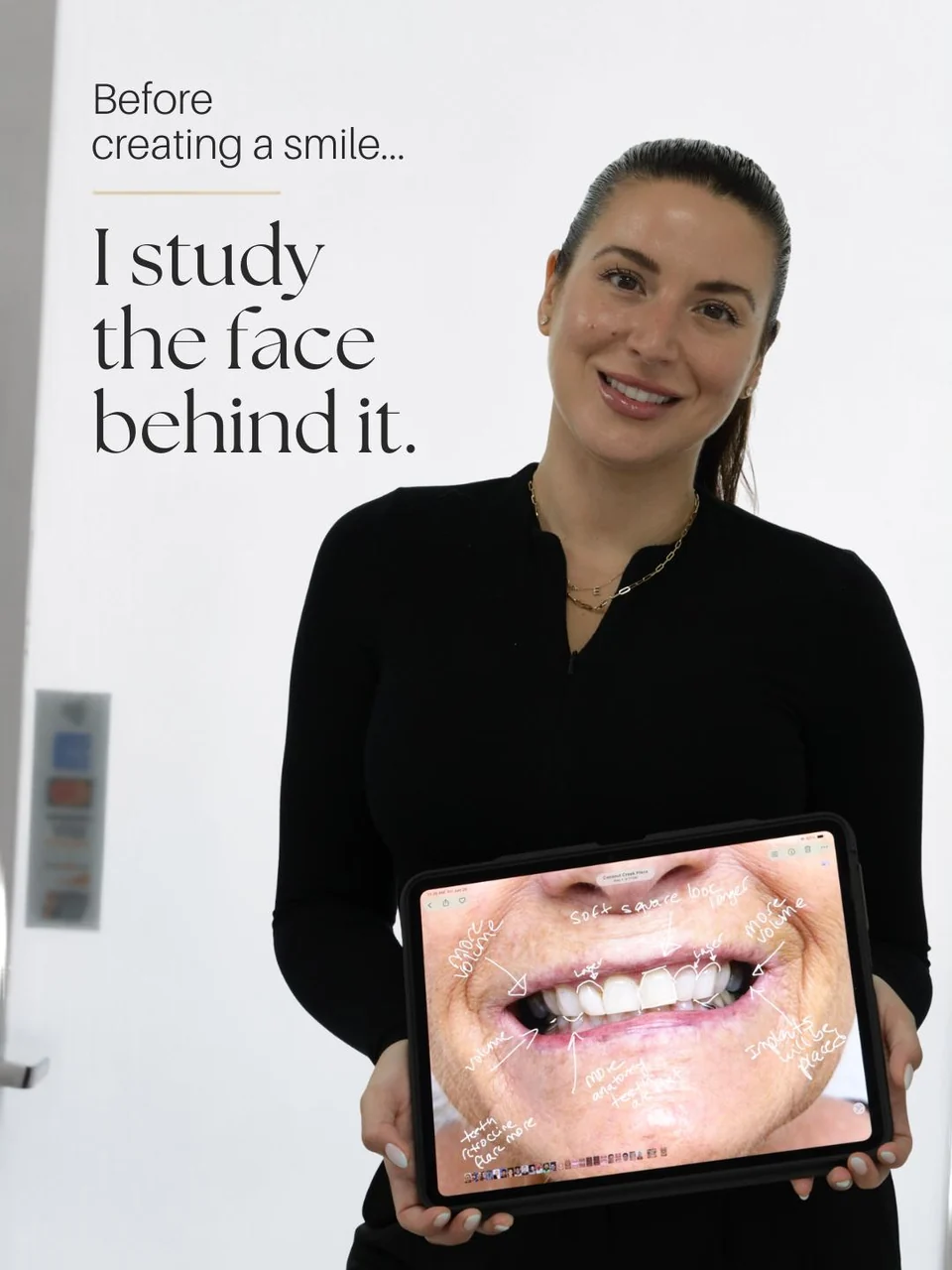 Dr. Emmy Estenoz holding an annotated smile-planning tablet.