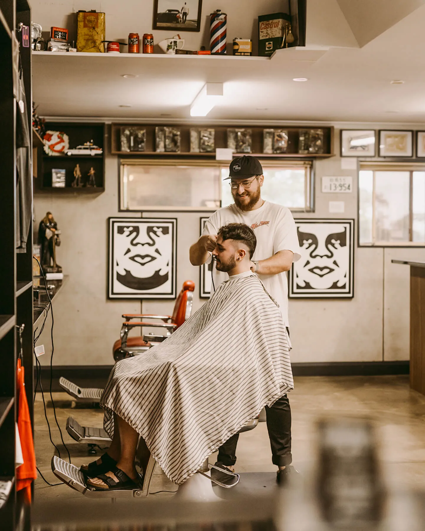 Dan and Nick, Hills barbers at Wiseguys Glenhaven, giving men’s haircuts.