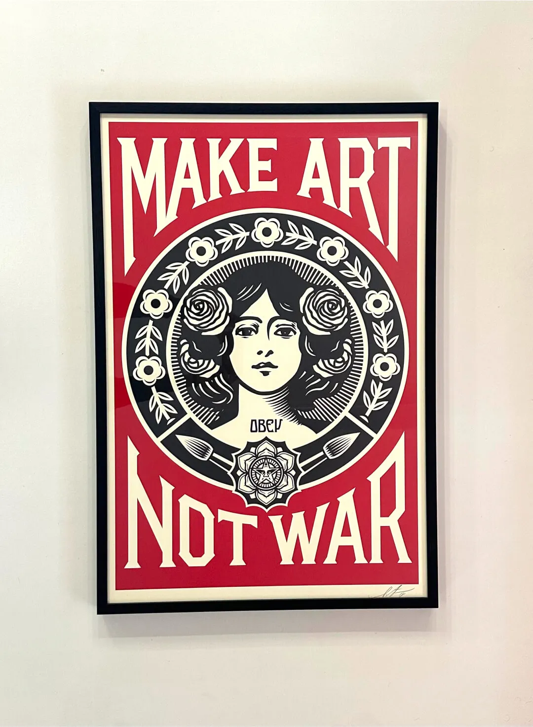 make art not war artwork by shepard fairey for sale at the wiseguys barbershop in glenhaven