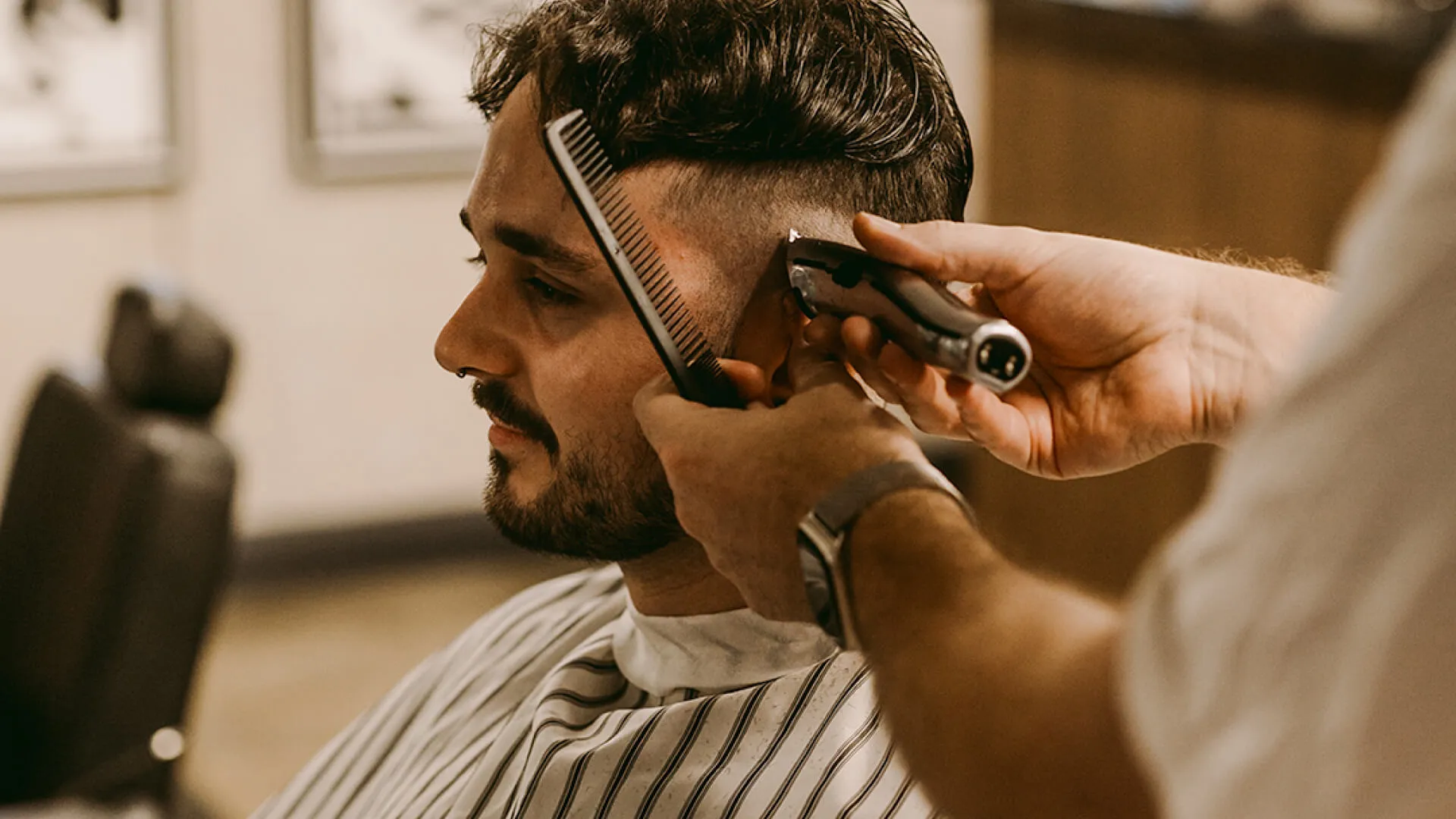 Dan and Nick, Hills barbers at Wiseguys Glenhaven, giving men’s haircuts.
