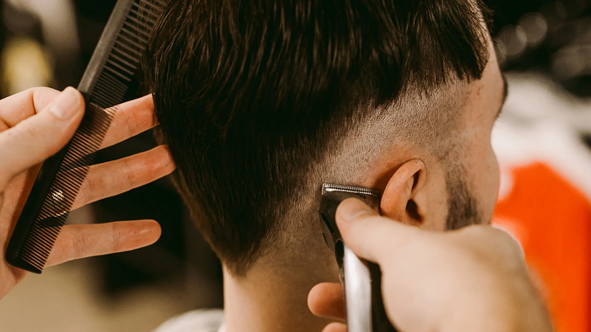 Dan and Nick, Hills barbers at Wiseguys Glenhaven, giving men’s haircuts.