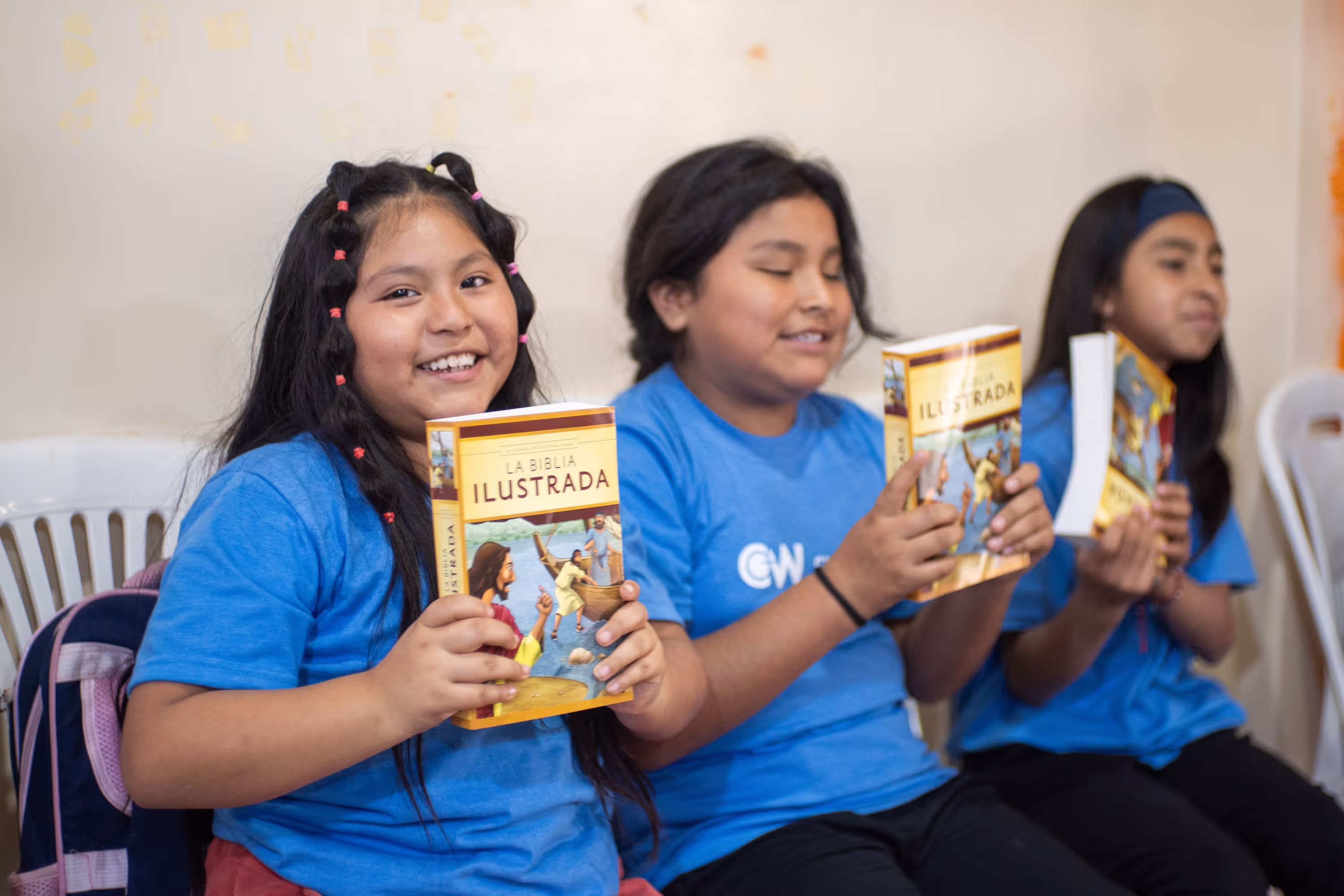 Kids holding bibles