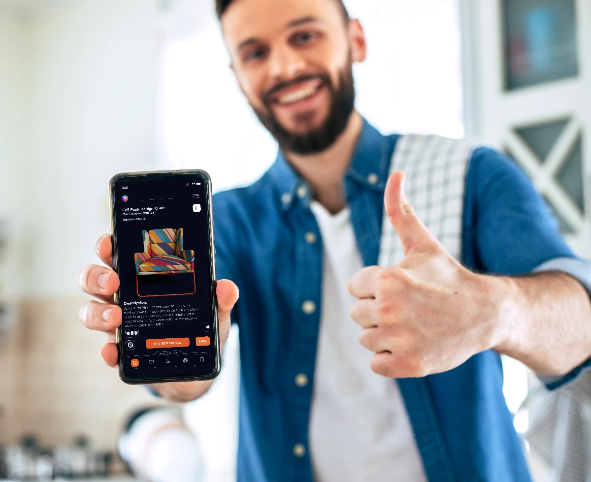 Man giving thumbs up while showing AYR Display on his phone with a new chair purchased. Furniture shopping cart, with description.