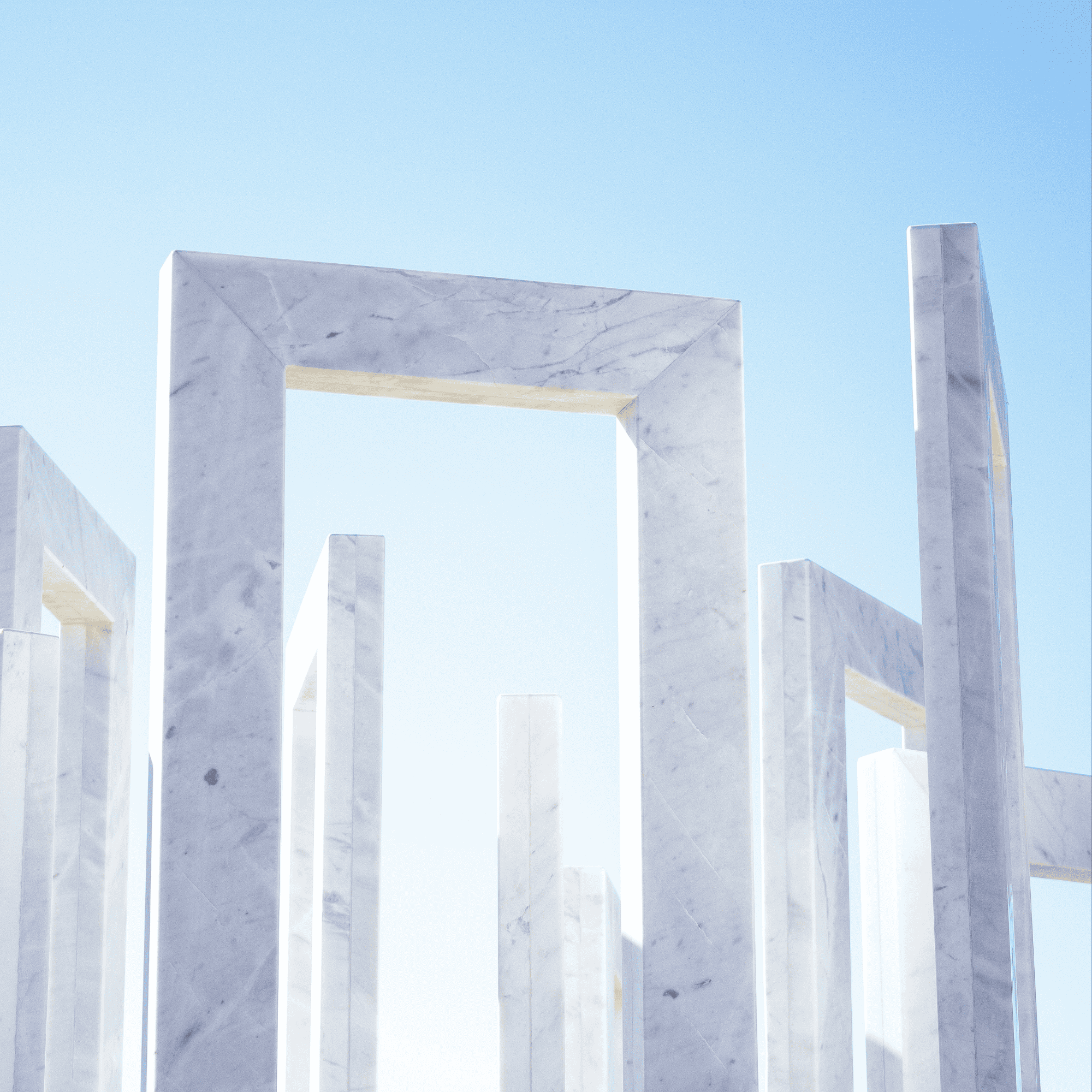 Modern marble architectural arches under a clear blue sky, symbolising strength, stability, and economic progress—representing Cyprus’s solid financial outlook and budget surplus in 2025.