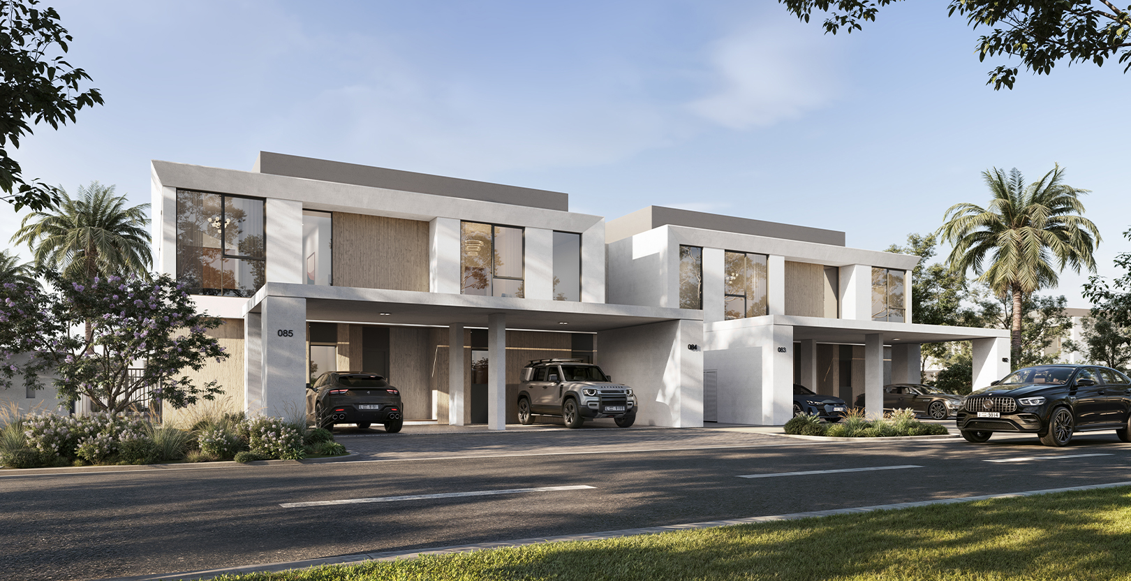 Modern duplex villas with luxury cars parked in driveways, surrounded by palm trees and greenery at Greenville, Emaar South