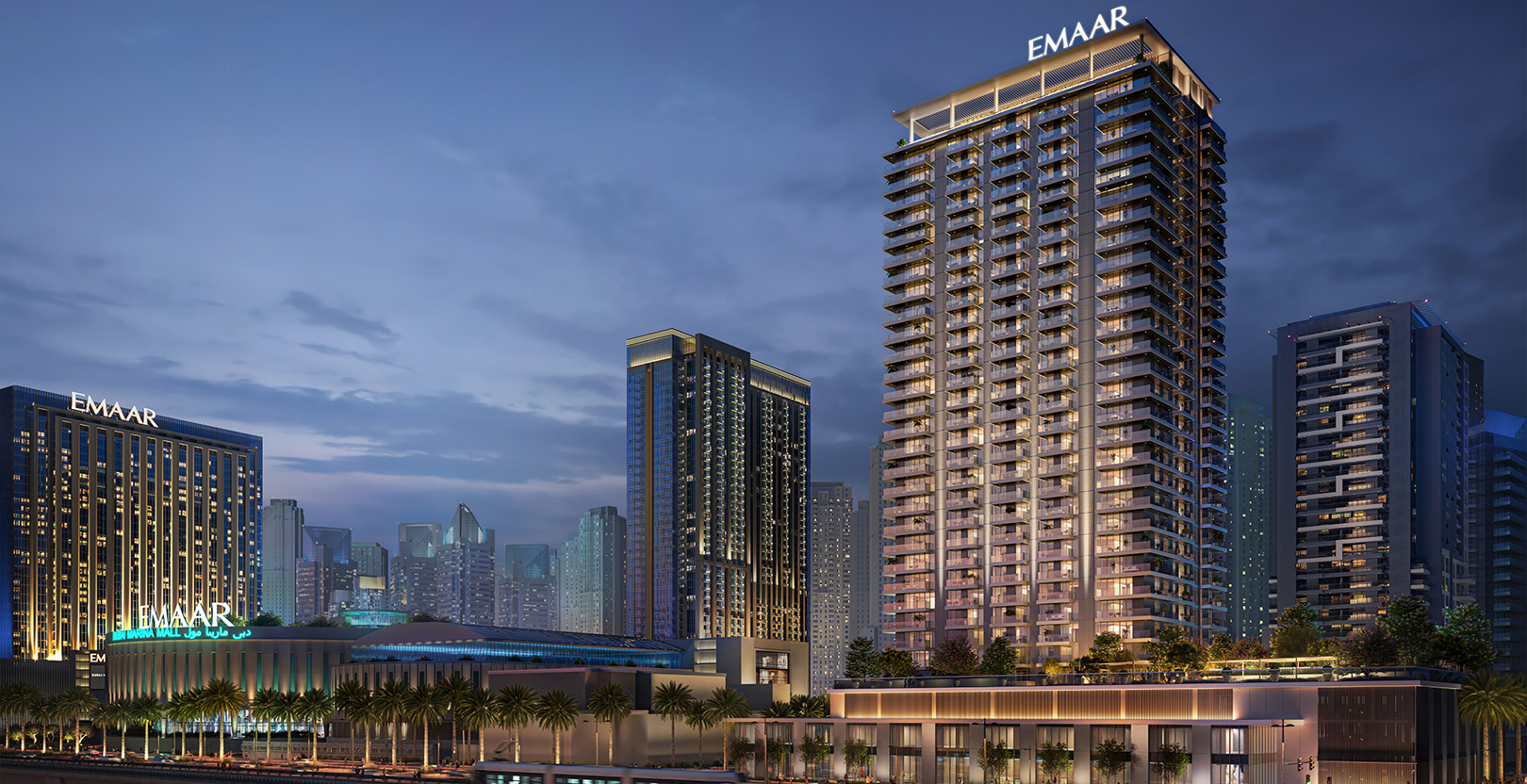 Illuminated Marina Cove at Dubai Marina with modern skyscrapers, Emaar buildings, and palm trees at dusk