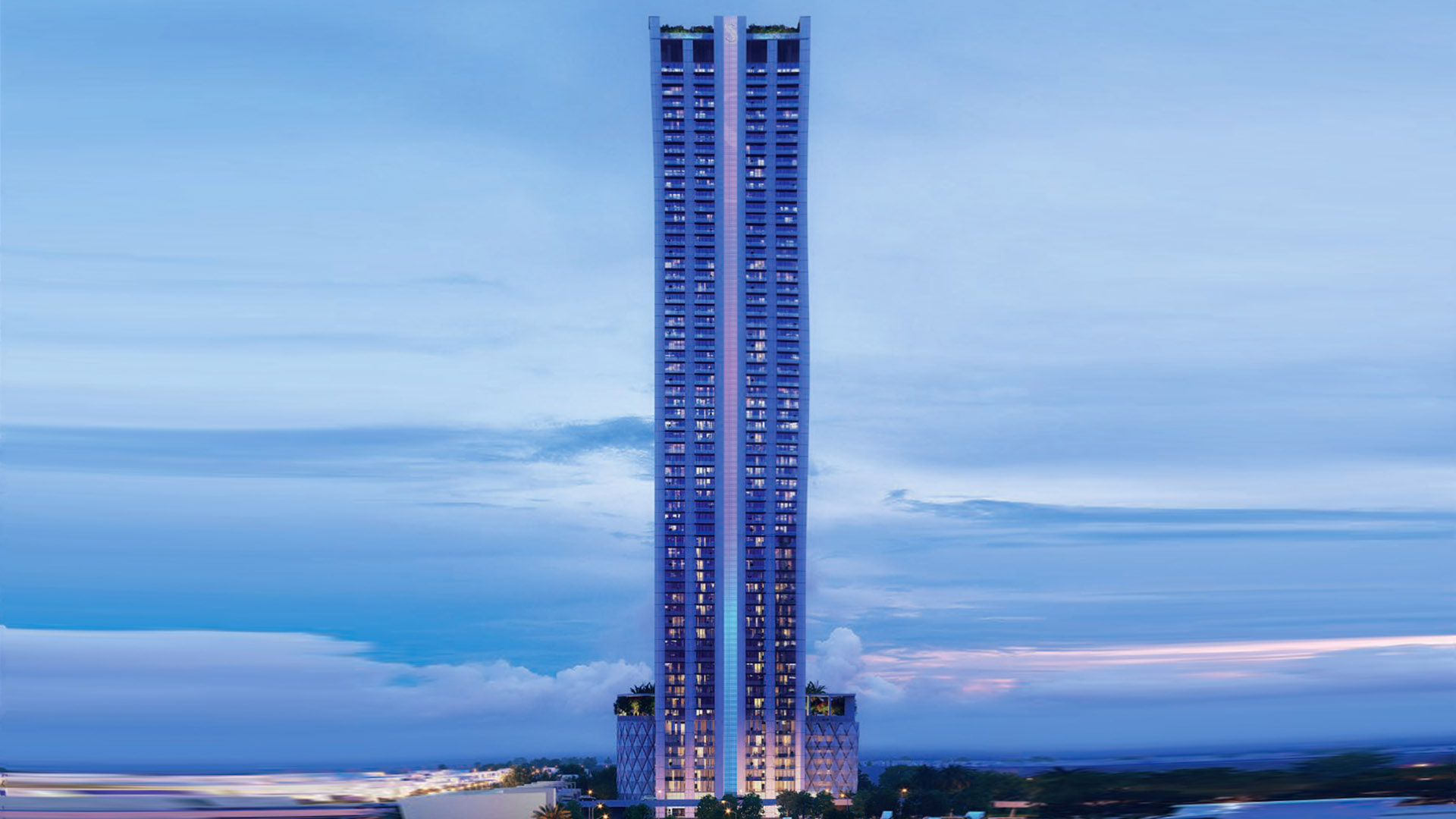 Verde by Sobha at JLT, a sleek modern skyscraper with illuminated windows against a serene blue sky backdrop