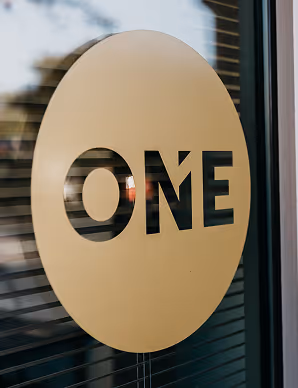 RealtyONEGroup ONE Coin Logo