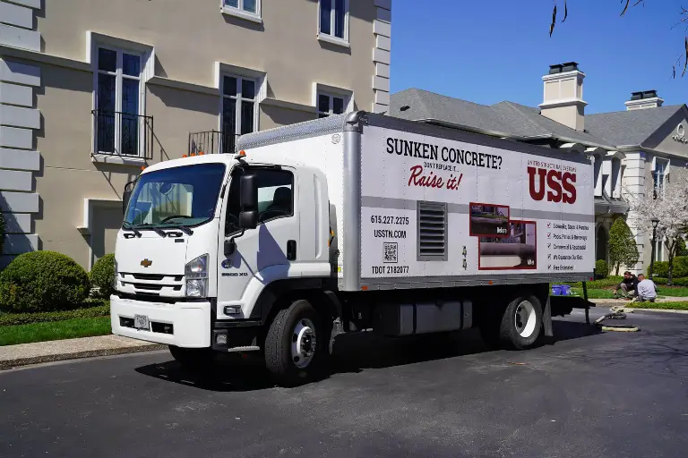 company box truck with the words concrete leveling services and an image of the service