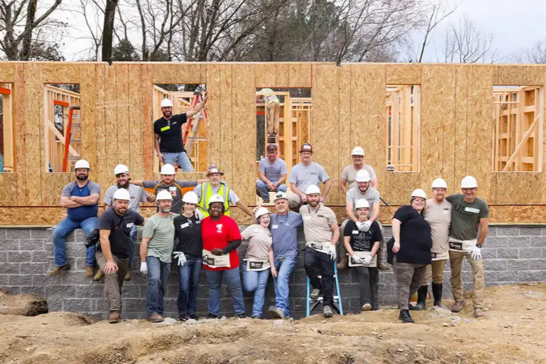 USS Group team volunteering with Habitat for Humanity to support community home-building efforts