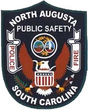 Badge of North Augusta Public Safety featuring an eagle with outspread wings and circular emblem, labeled Police and Fire, South Carolina.