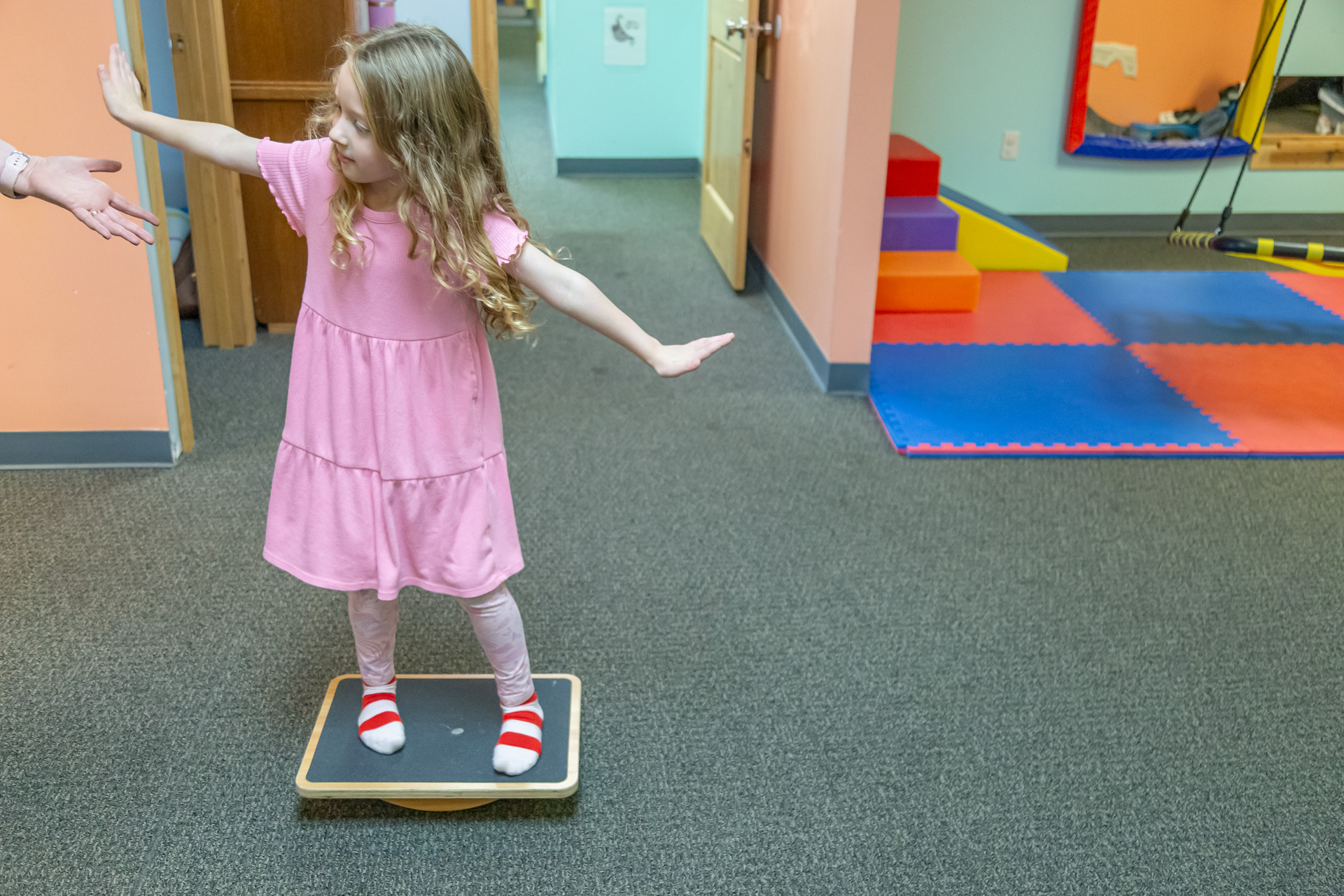 A photo of a child engaging in a sensory‑motor activity