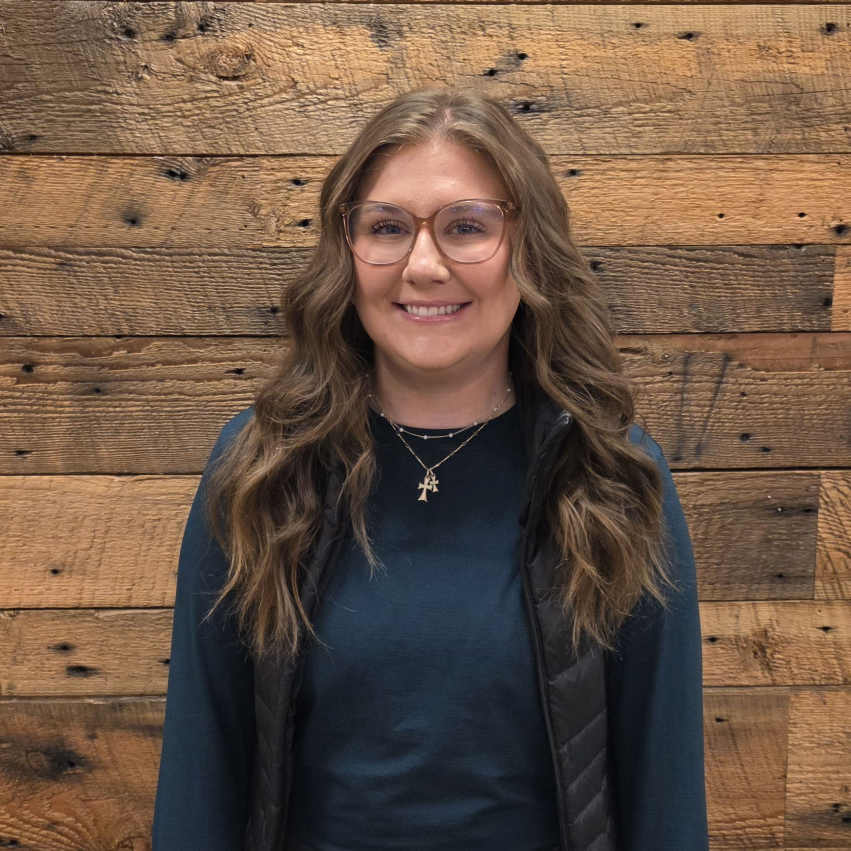 Francesca smiling in a warm, professional headshot for the ATC team.