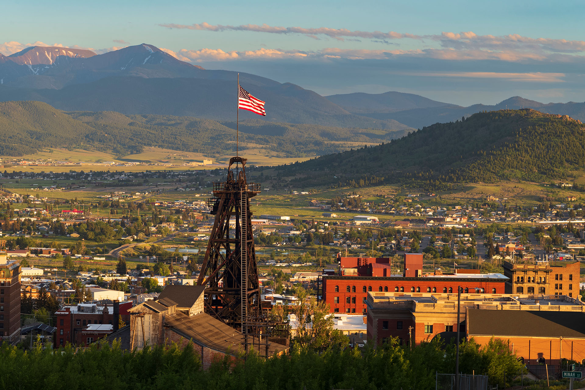 Butte Montana mining headframe overlooking the valley, symbolizing local community spaces where children build confidence and everyday independence
