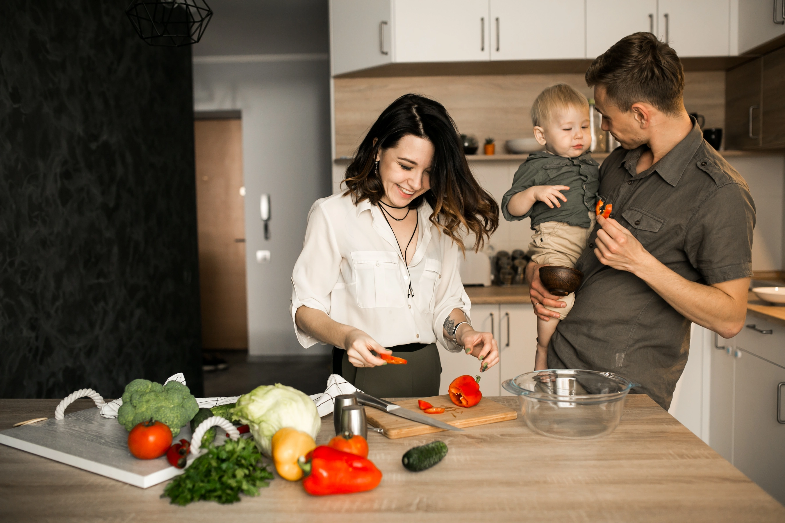 Young family in kitchen of townhouse