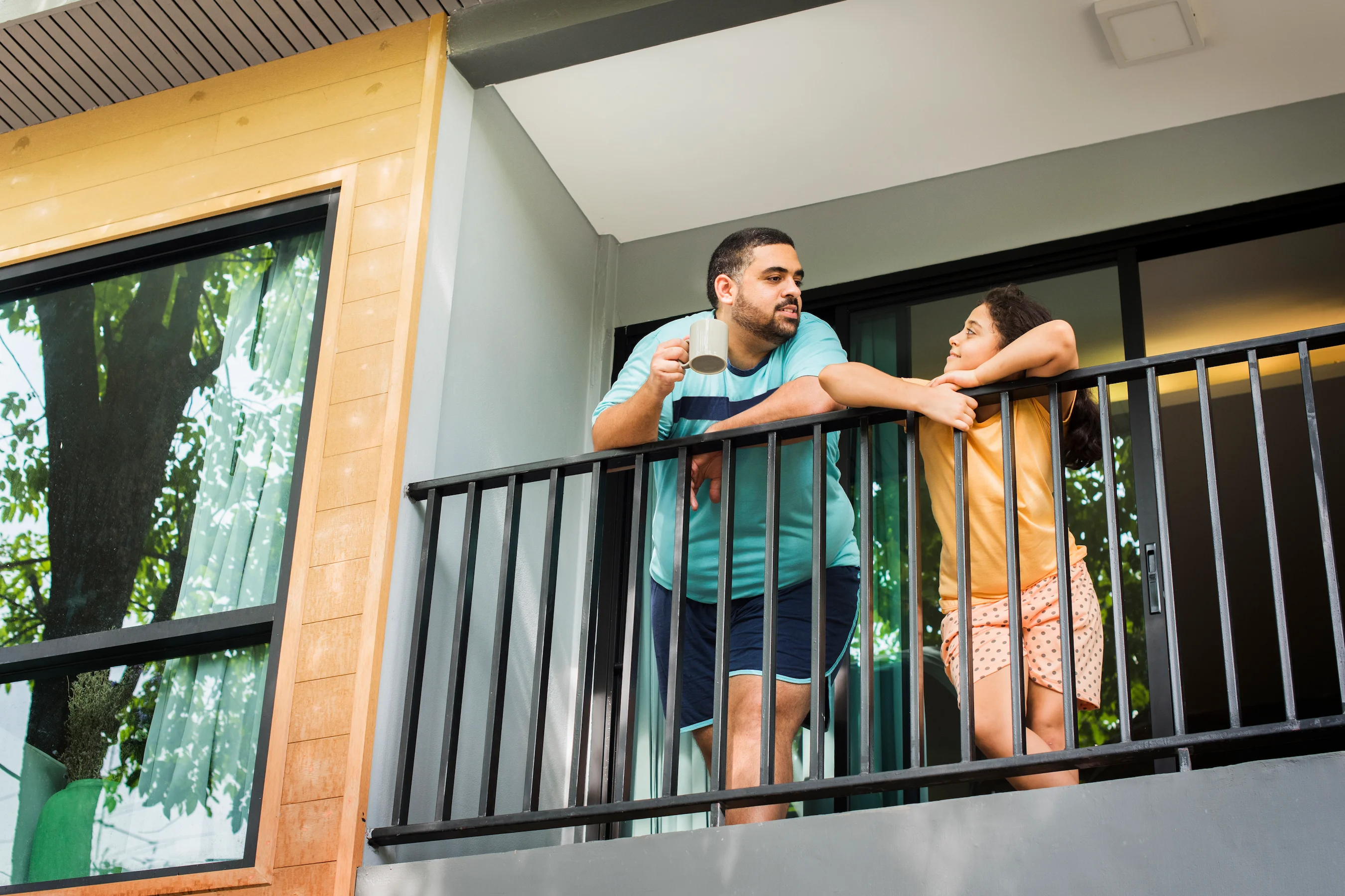 Young family on apartment balcony